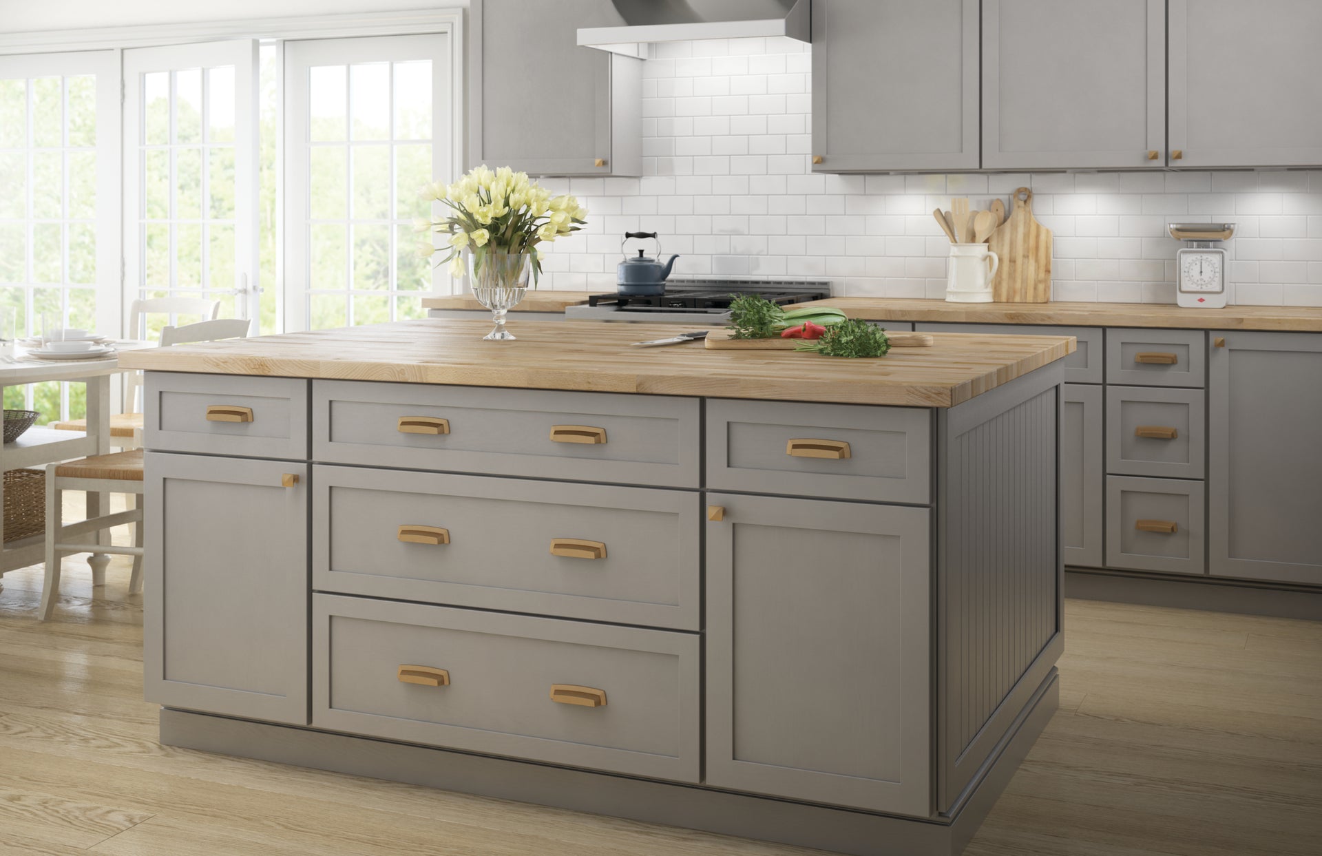 Modern kitchen with a central island featuring wooden countertop and gray cabinets.