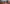 Black metal handle held by hands with a blurred background