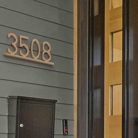 Front door of a home with house numbers 3508 above a mailbox