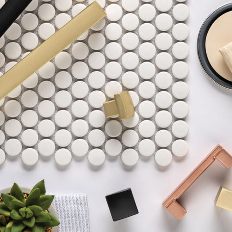 Cabinet hardware shown with paint, brush, and decorative items